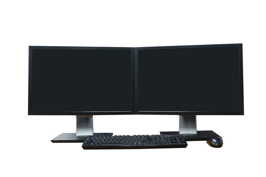 Two computer monitors side by side with blank screens