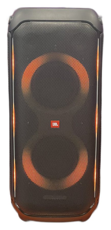 A tall black JBL party speaker with glowing orange light rings