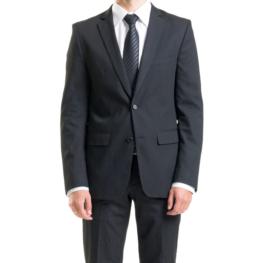 A dark suit with white shirt and tie on an invisible mannequin